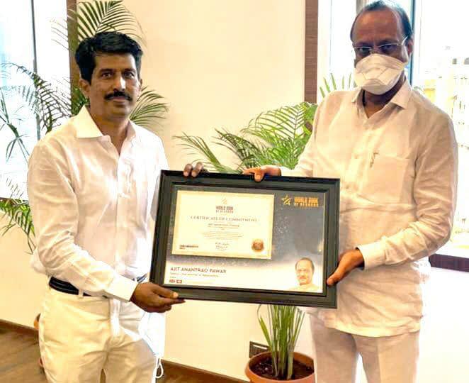 Ajit Pawar Deputy Chief Minister of Maharashtra, gets felicitated with certificate of Commitment (Switzerland) by Deepak Harke National secretary WBR India
